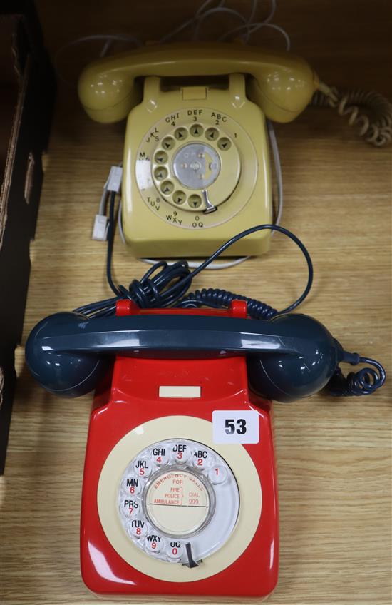 A red cream and blue Rotary phone and another